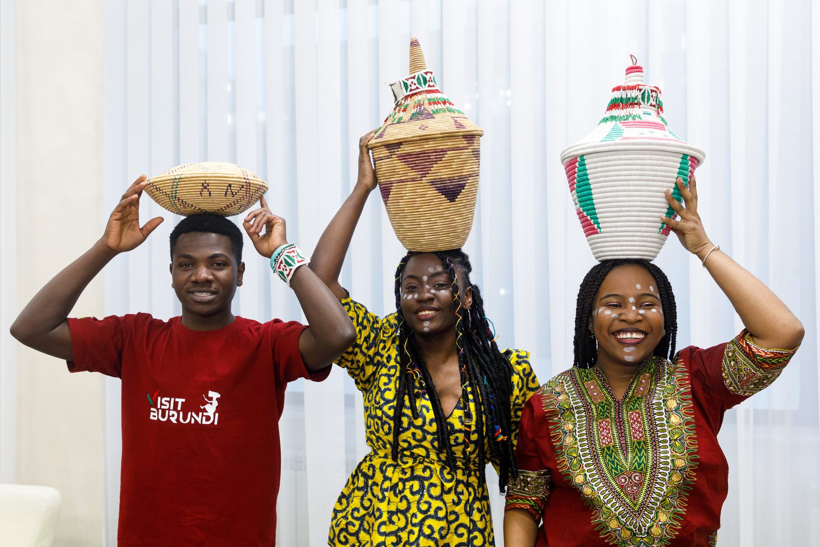 Students carrying traditional woven baskets at the Festival of Cultures