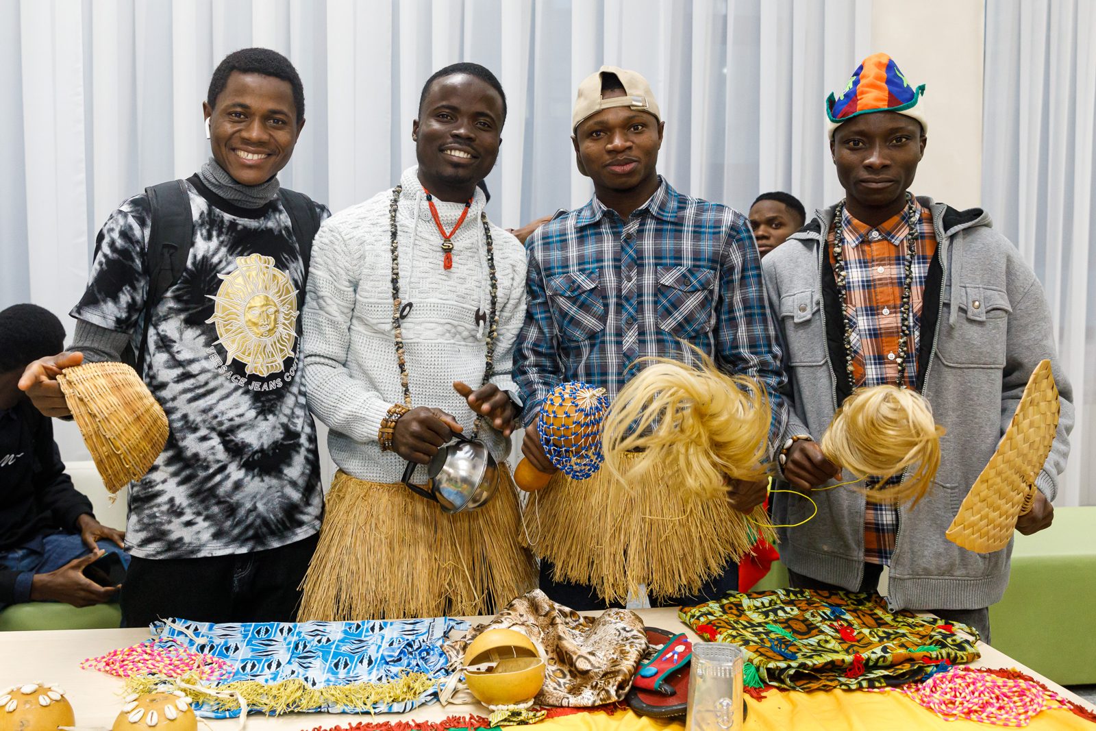 Students presenting traditional masks and crafts of their countries