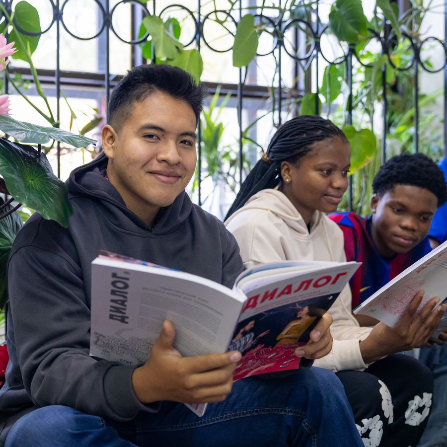 Students reading together in a lounge